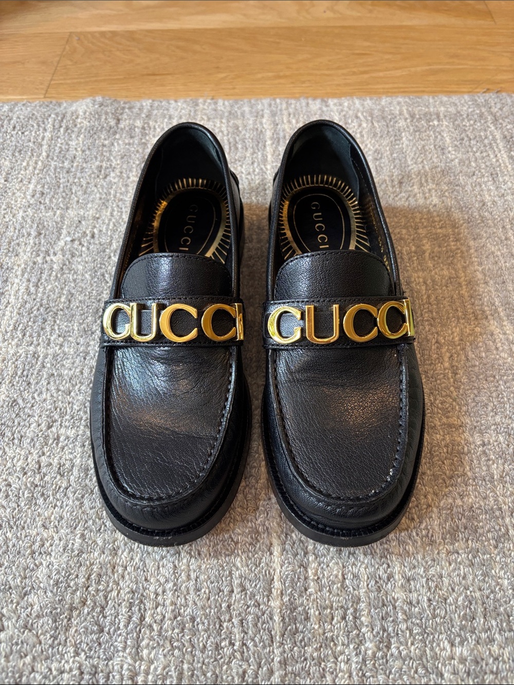 Gucci Black Leather Loafers with Gold Logo Strap